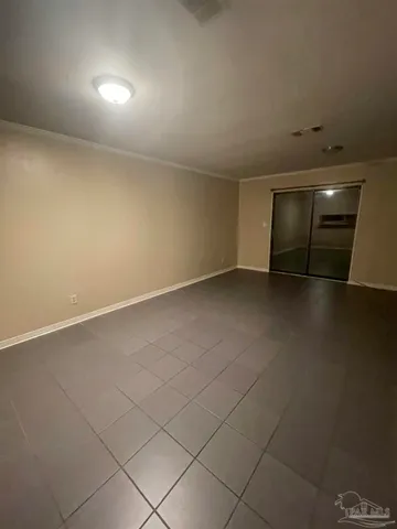 an empty room with a empty space and window