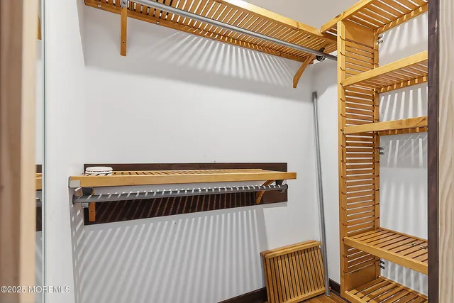 a view of a balcony with wooden floor