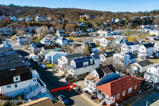an aerial view of a city with ocean view