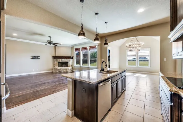a kitchen with granite countertop counter space a sink and appliances