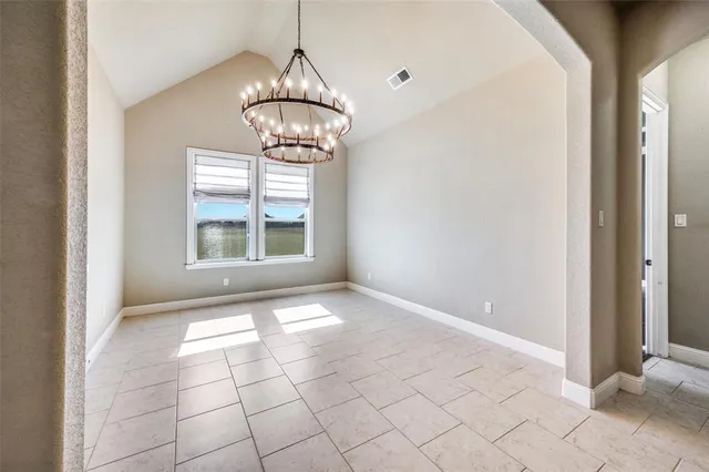 a view of empty room with windows