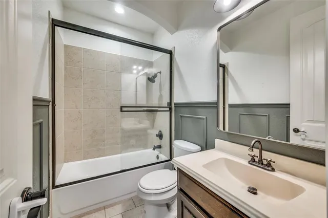 a kitchen with granite countertop cabinets and utility