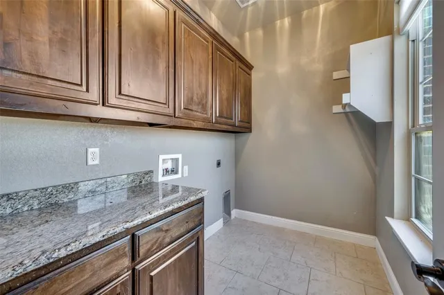 a view of a hallway with wooden floor and entryway