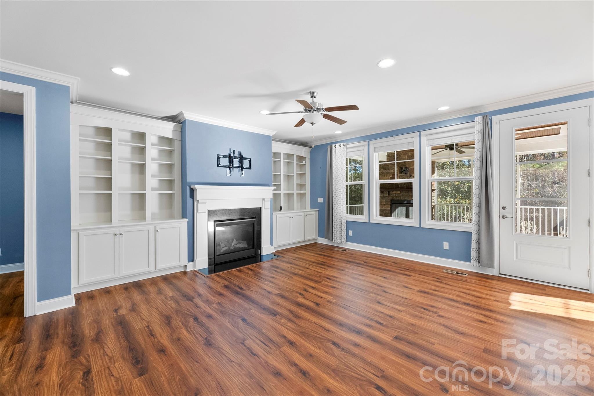 6065 Chimney Bluff Road Lancaster, SC 29720 - Photo 11 of 43 a view of an empty room with a window and wooden floor