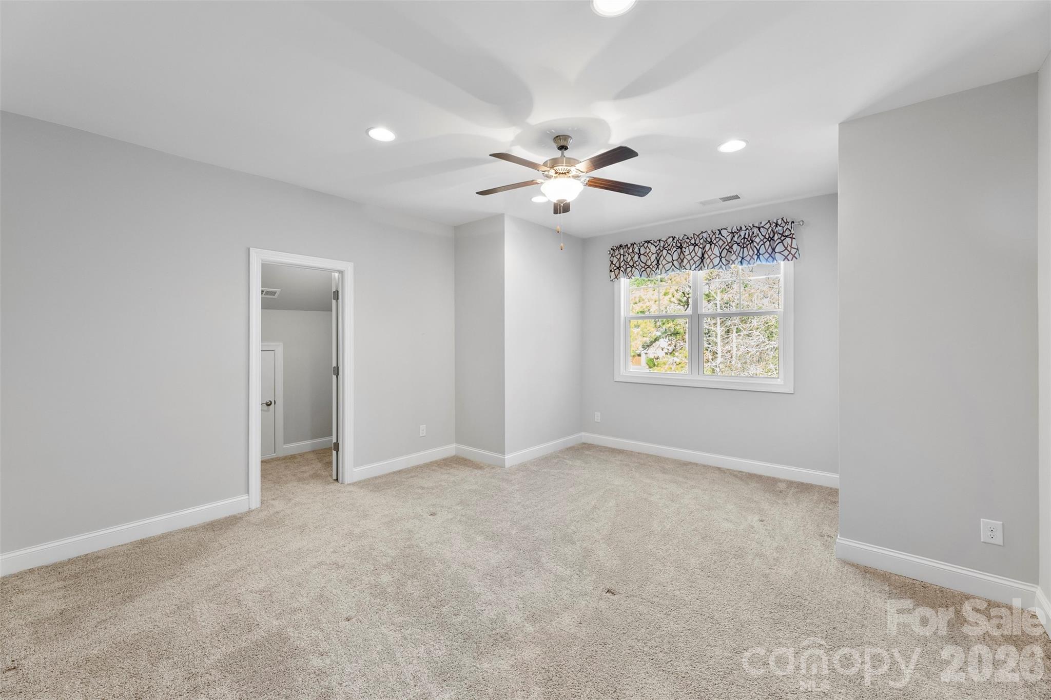6065 Chimney Bluff Road Lancaster, SC 29720 - Photo 24 of 43 an empty room with window and ceiling fan