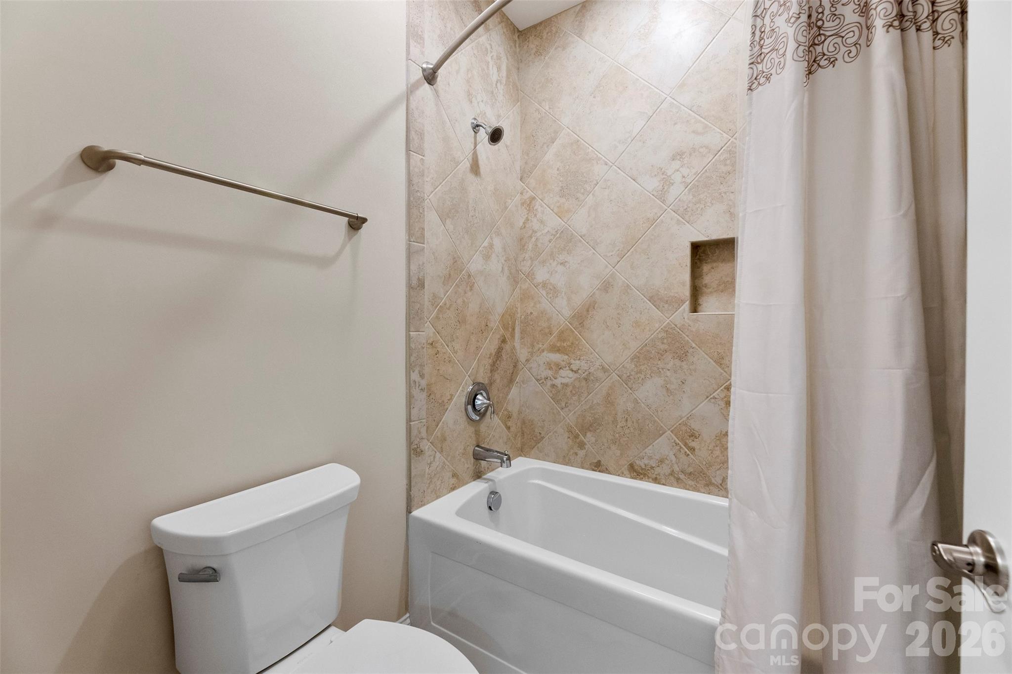 6065 Chimney Bluff Road Lancaster, SC 29720 - Photo 35 of 43 a bathroom with a toilet and a bathtub