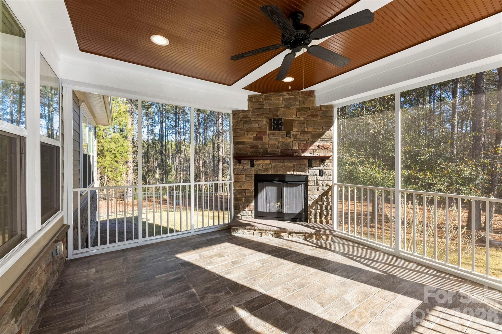 6065 Chimney Bluff Road Lancaster, SC 29720 - Photo 36 of 43 a living room with a fireplace and a table