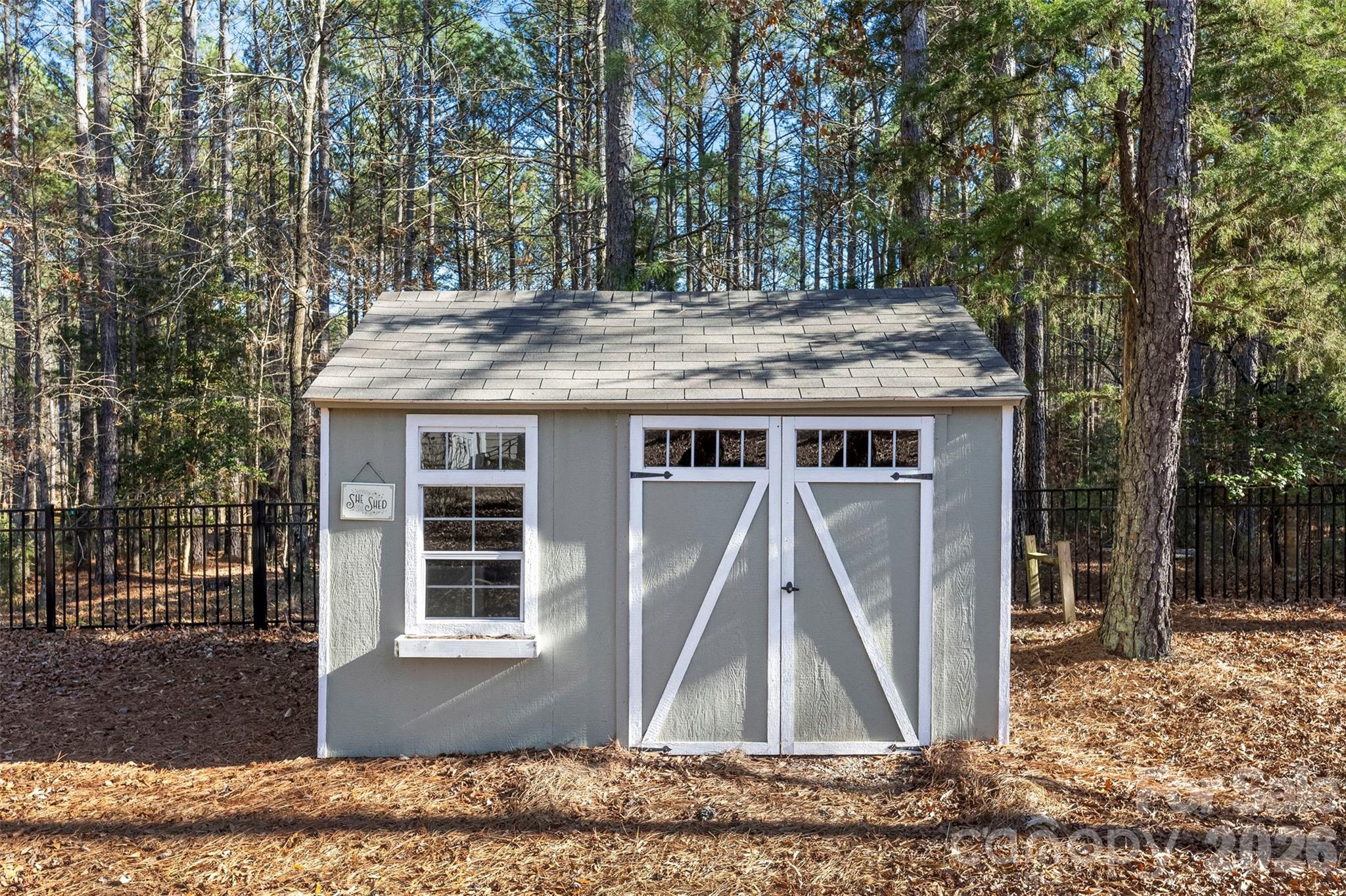 6065 Chimney Bluff Road Lancaster, SC 29720 - Photo 40 of 43 a view of a house with a wooden deck and a trees
