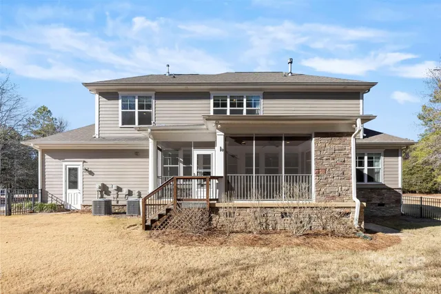 a view of a swimming pool with roof and sitting space
