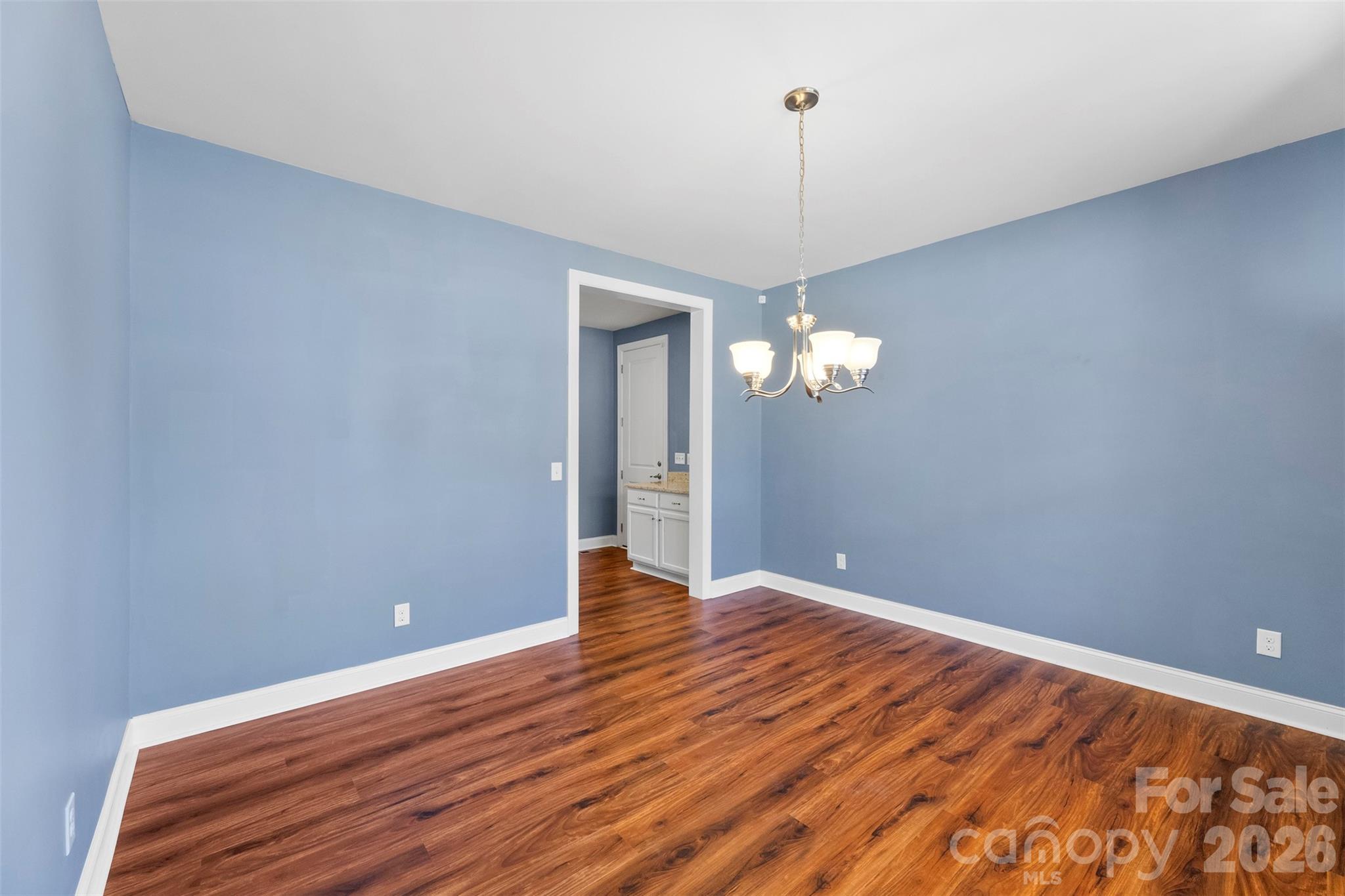 6065 Chimney Bluff Road Lancaster, SC 29720 - Photo 5 of 43 a view of empty room with wooden floor and ceiling fan