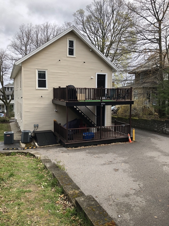 72 Bennett Street, Unit 72 Boston, MA 02135 - Photo 16 of 17 a view of house with backyard and trees