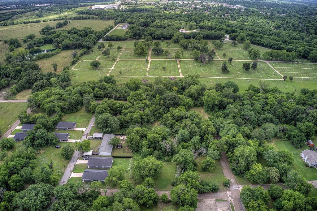 0 Sycamore Street Commerce, TX 75428 - Photo 8 of 14 an aerial view of a house with a yard