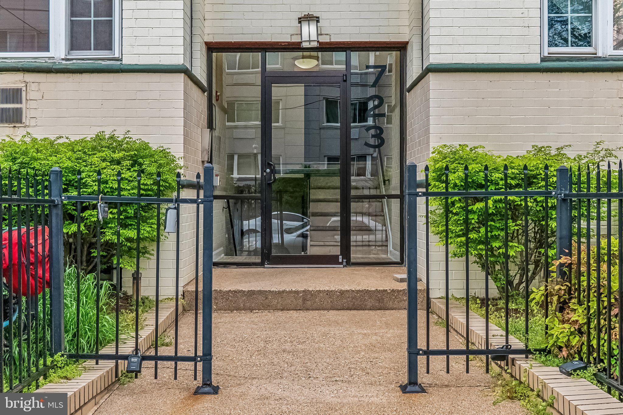 723 Longfellow Street Northwest, Unit 102 Washington, DC 20011 - Photo 4 of 17 a front view of a house with a porch