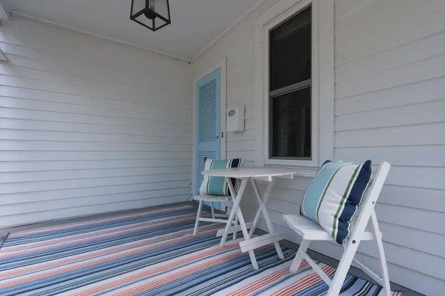 a view of a chairs and table in patio