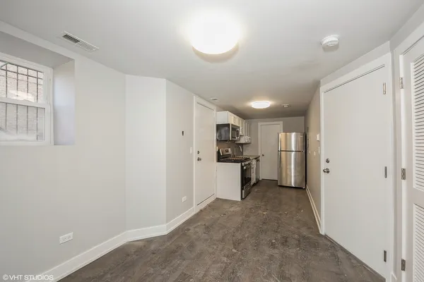 a view of kitchen and refrigerator