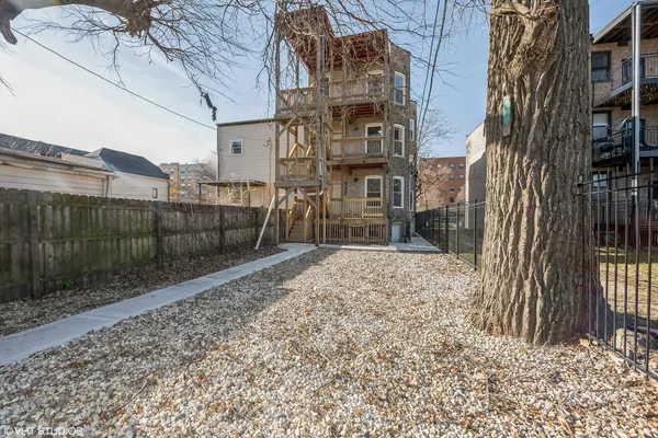 a view of a backyard with a trees
