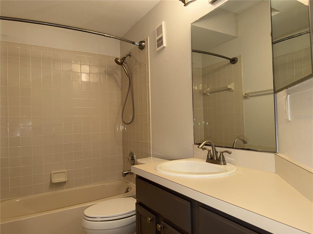 550 Cranes Way, Unit 116 Altamonte Springs, FL 32701 - Photo 14 of 29 a bathroom with a sink toilet vanity and shower