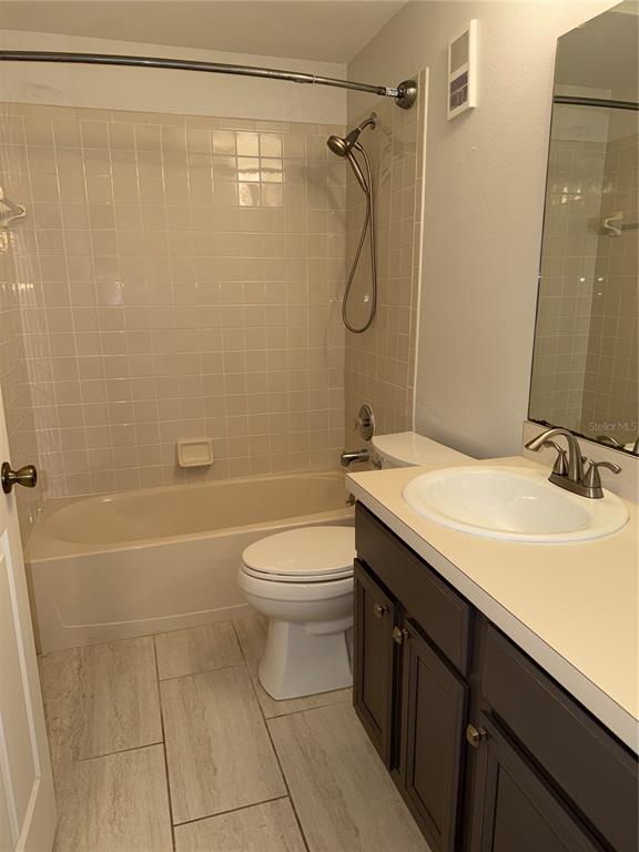 550 Cranes Way, Unit 116 Altamonte Springs, FL 32701 - Photo 15 of 29 a bathroom with a granite countertop sink toilet and shower