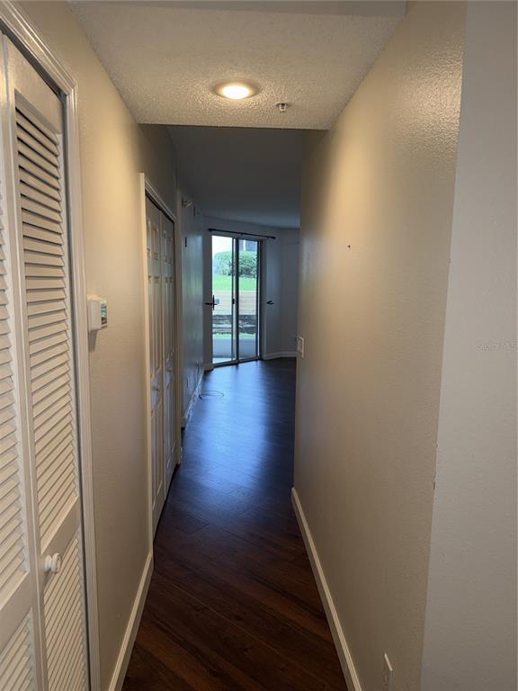 550 Cranes Way, Unit 116 Altamonte Springs, FL 32701 - Photo 16 of 29 a view of a hallway with wooden floor