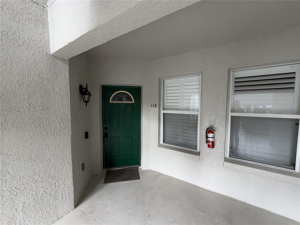 550 Cranes Way, Unit 116 Altamonte Springs, FL 32701 - Photo 2 of 29 an empty room with a fireplace and window