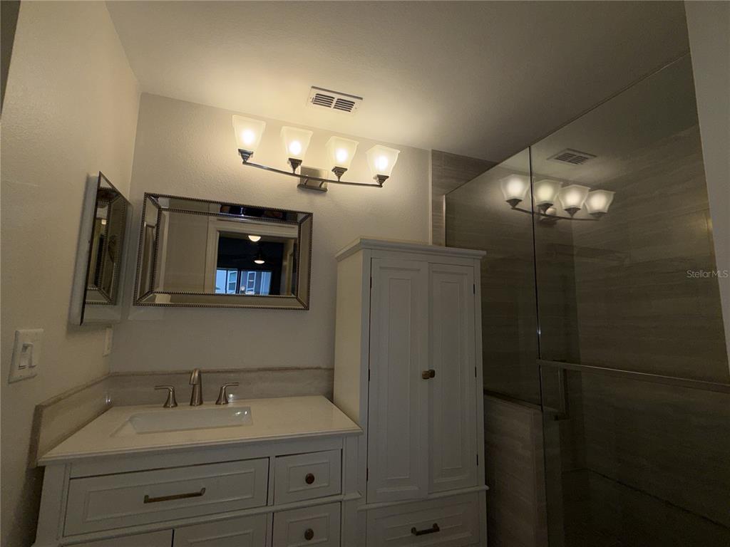 550 Cranes Way, Unit 116 Altamonte Springs, FL 32701 - Photo 23 of 29 a bathroom with a sink and a mirror