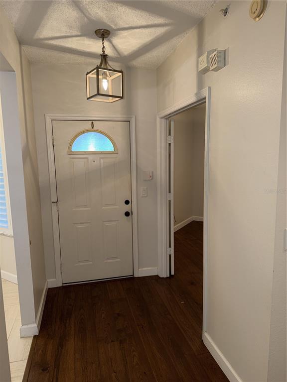 550 Cranes Way, Unit 116 Altamonte Springs, FL 32701 - Photo 3 of 29 an empty room with wooden floor and windows