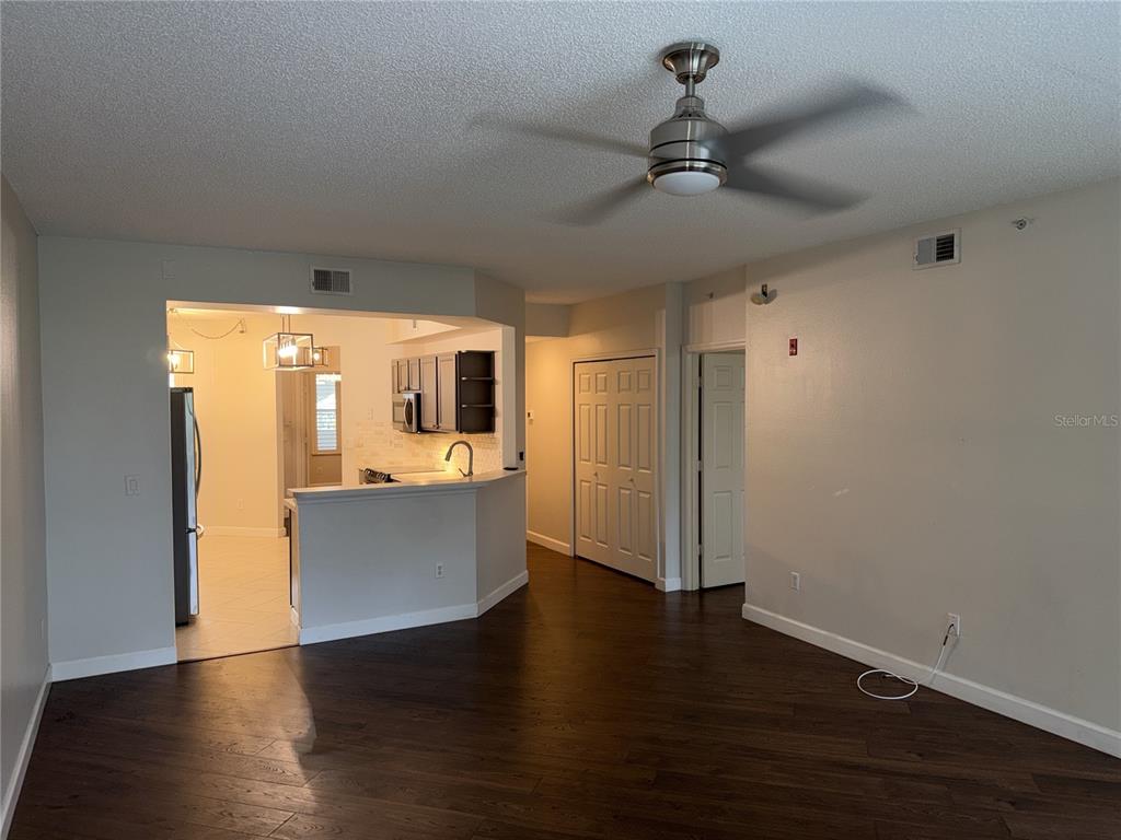 550 Cranes Way, Unit 116 Altamonte Springs, FL 32701 - Photo 10 of 29 a view of a kitchen with a sink and wooden floor