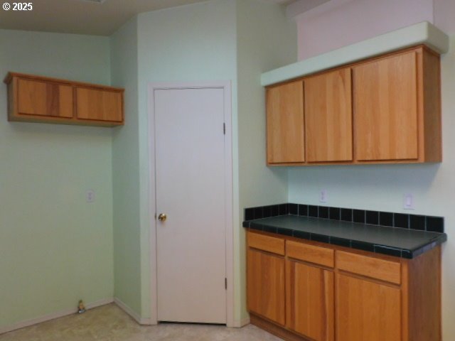 145 River Road Junction City, OR 97448 - Photo 15 of 35 a kitchen with stainless steel appliances granite countertop white cabinets and a refrigerator