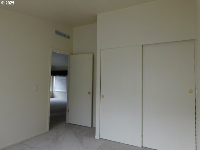 145 River Road Junction City, OR 97448 - Photo 19 of 35 a view of a hallway with wooden cabinets