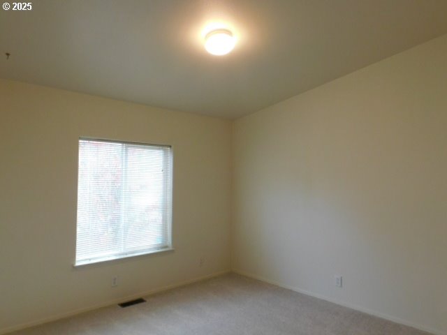 145 River Road Junction City, OR 97448 - Photo 21 of 35 an empty room with a window