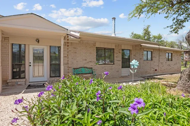 a front view of a house with yard