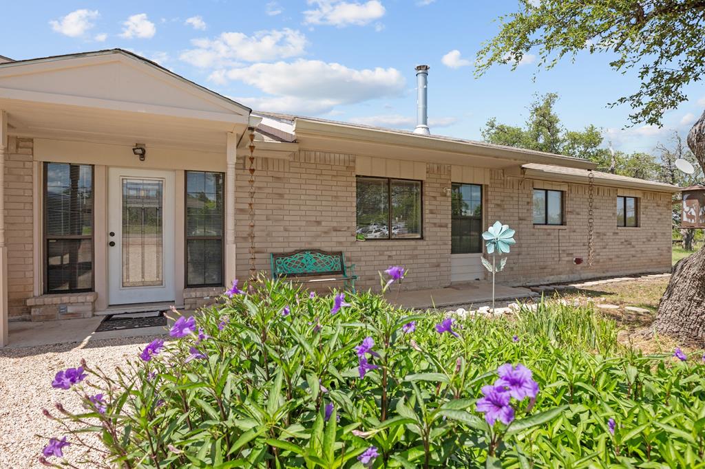 64 Quail Run Harper, TX 78631 - Photo 1 of 25 a front view of a house with yard