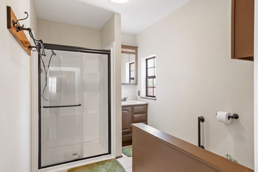 64 Quail Run Harper, TX 78631 - Photo 15 of 25 a bathroom with a shower and a sink