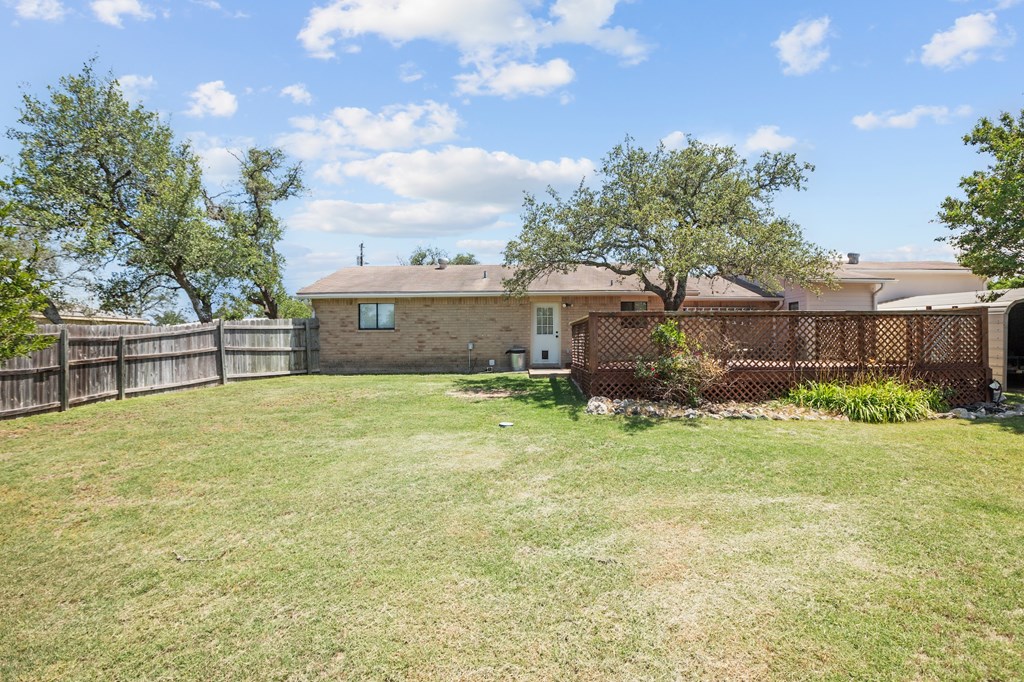 64 Quail Run Harper, TX 78631 - Photo 18 of 25 a front view of a house with a yard