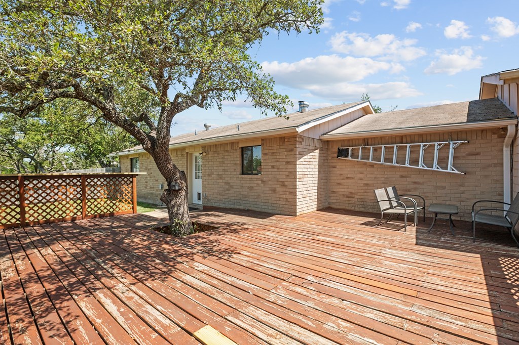 64 Quail Run Harper, TX 78631 - Photo 22 of 25 a backyard of a house with seating space