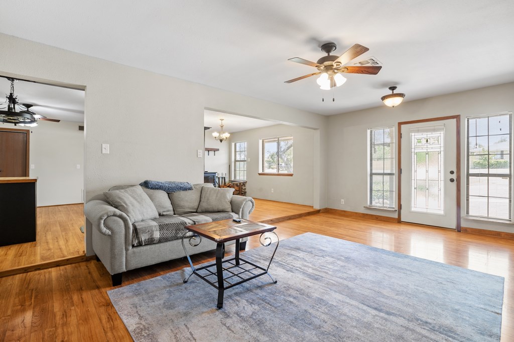 64 Quail Run Harper, TX 78631 - Photo 6 of 25 a living room with furniture and a wooden floor