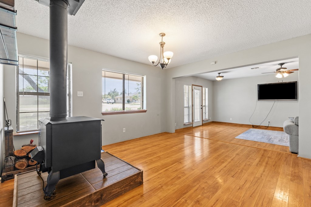 64 Quail Run Harper, TX 78631 - Photo 7 of 25 a bedroom with a bed and a flat screen tv