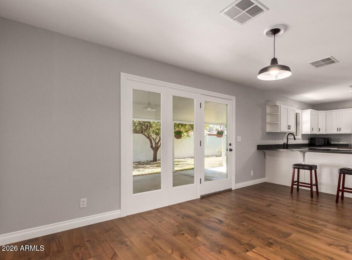 607 West 15th Street Tempe, AZ 85281 - Photo 11 of 29 a view of a kitchen with wooden floor and a window