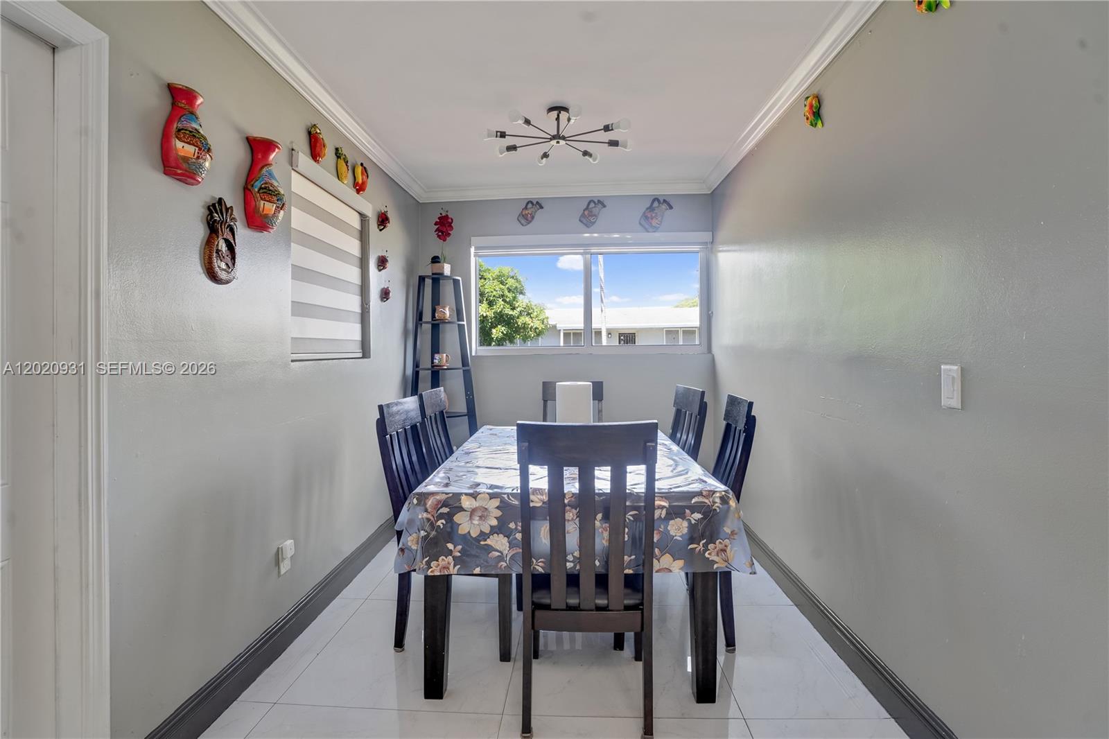 1360 Northwest 77th Street Miami, FL 33147 - Photo 7 of 41 a view of a dining room with furniture and window