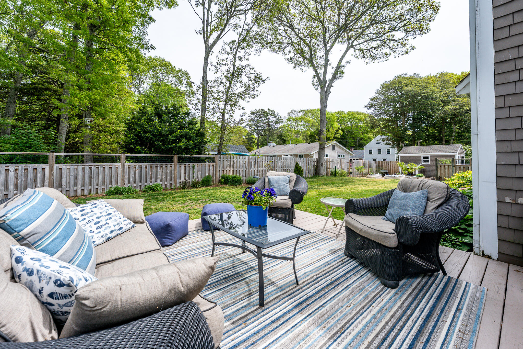 61 Angus Way Centerville, MA 02632 - Photo 43 of 59 a view of a patio with couches chairs and a fire pit