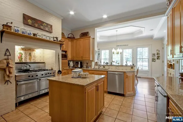 a kitchen with a stove a sink and a refrigerator