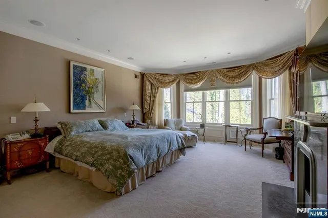 a spacious bedroom with a bed and a couch