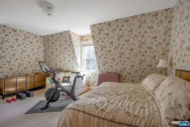 a view of a bedroom with bed and a couch
