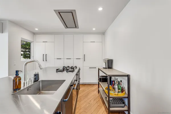 a living room with furniture large window and a table