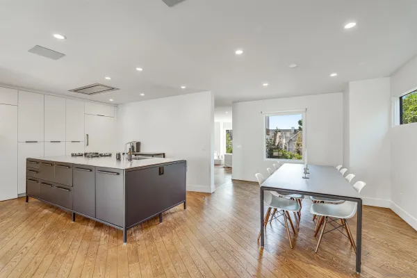 a view of kitchen with furniture and wooden floor