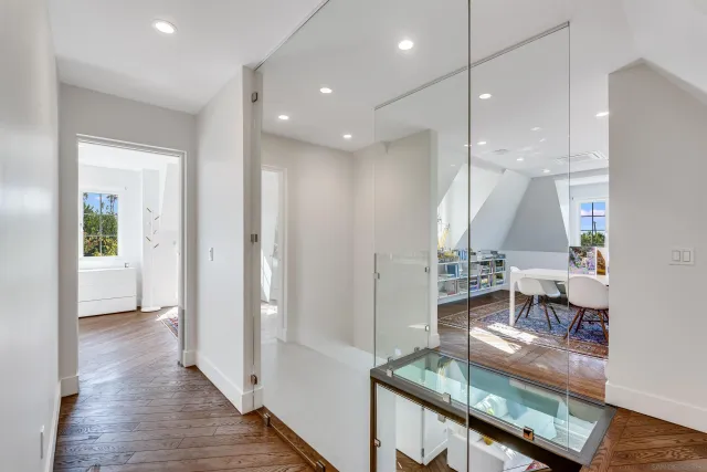 a bedroom with a large bed and a large window