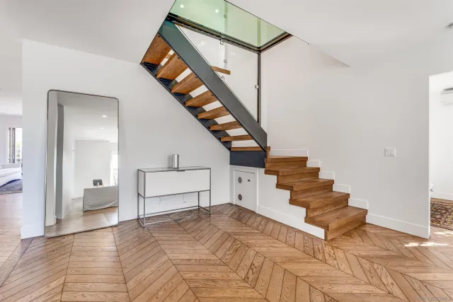 a kitchen with stainless steel appliances a sink stove and cabinets