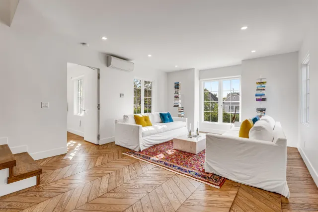 a kitchen with stainless steel appliances a sink and a refrigerator