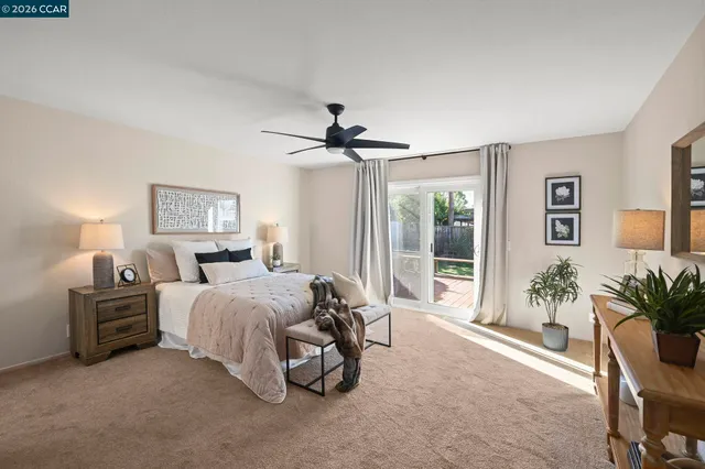 a bed room with a bed and a chair