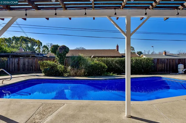 a view of a swimming pool with a patio